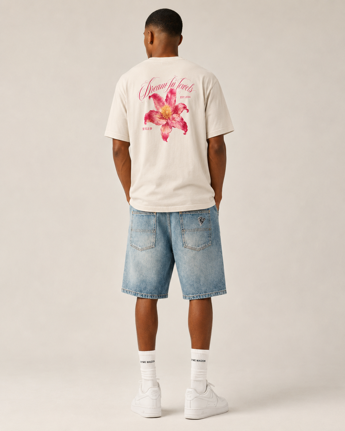 Cream lily-print tee photographed from the back